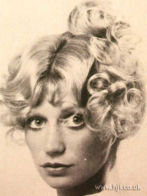 1970s Curly Blonde Updo With Fringe 1970s Curly Blonde Updo With Fringe