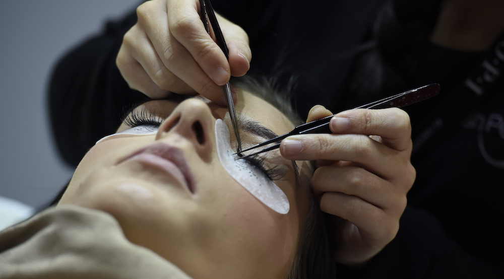 What advice can I give to clients who have damaged lashes from extensions?