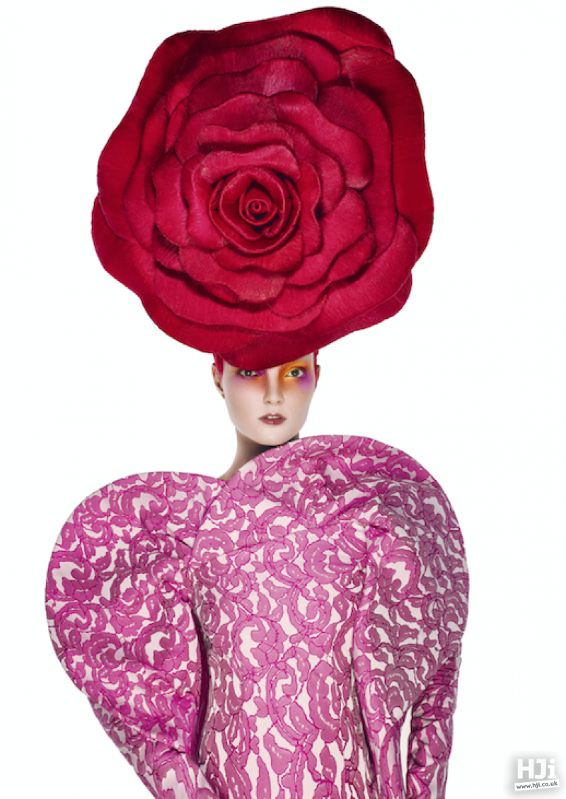 Avant garde styling with giant red rose