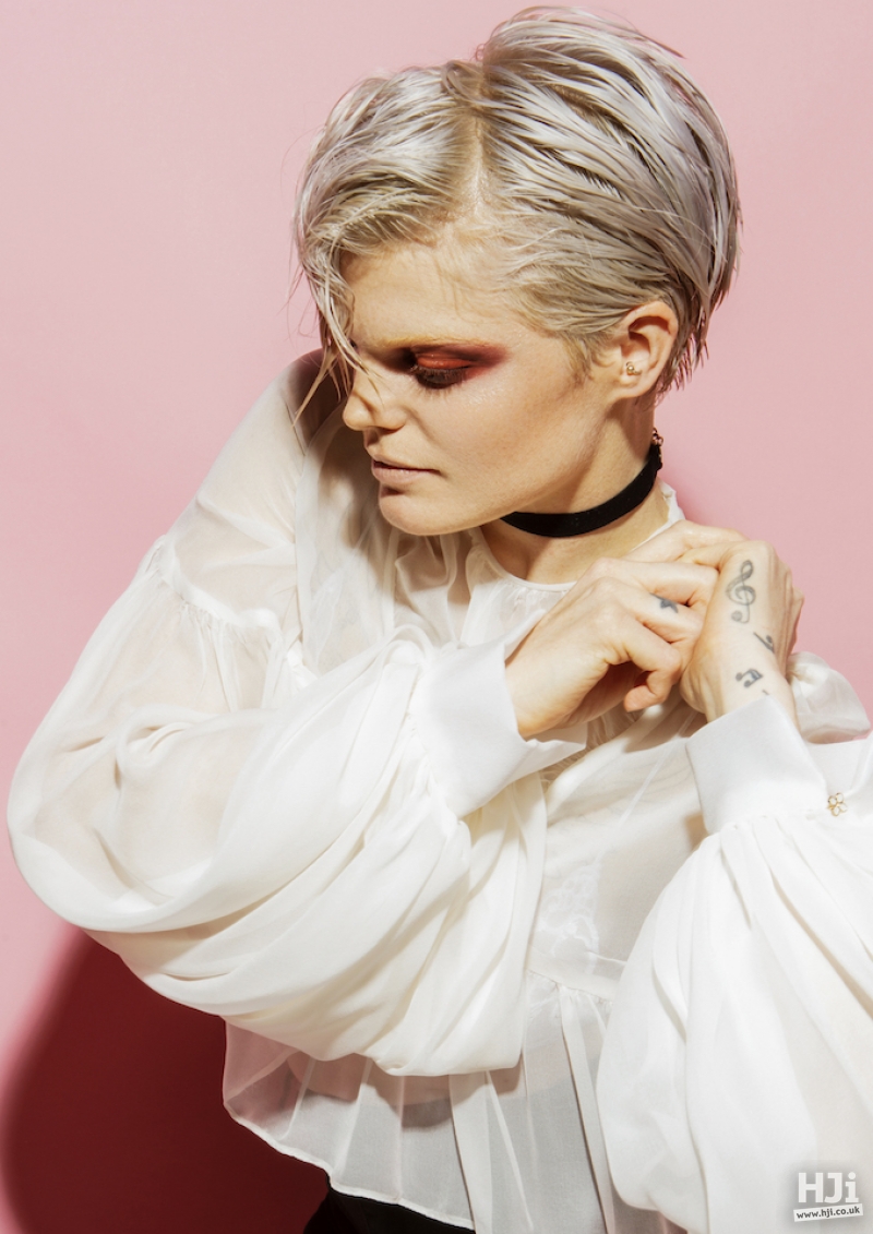 Platinum short crop with deep side parting and sleek wet look