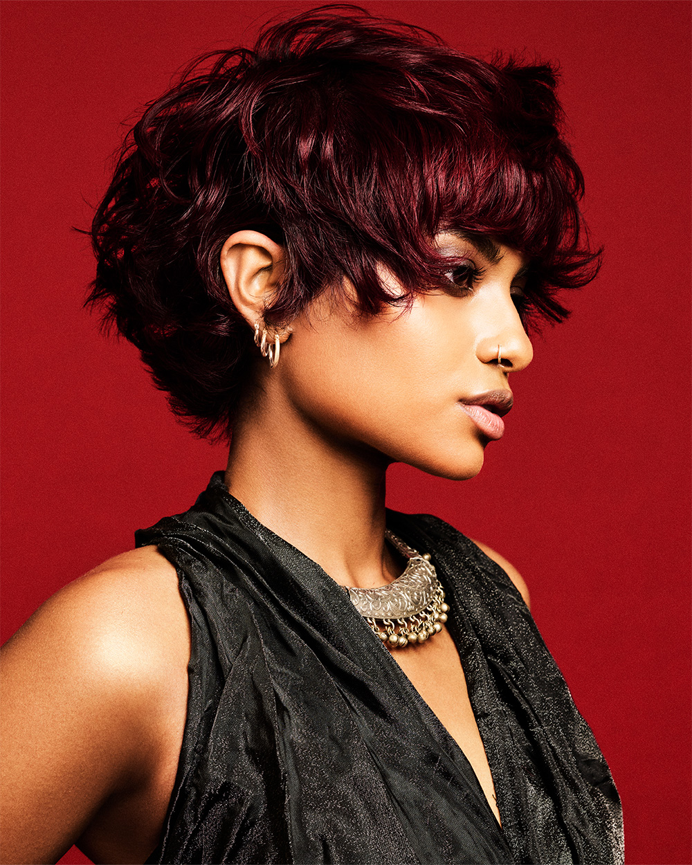 Nuru Perkins - BHA Midlands Hairdresser of the Year 2025 - Dark Brown, Fluffy, Natural, and Textured Pixie Cut with Red Highlights