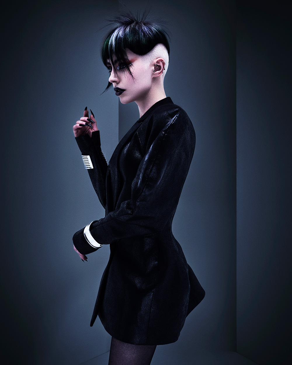 Casey Coleman - BHA Wales and South West Hairdresser of the Year 2025 - Dark, Spiky Undercut with Shaved Sides and a Vibrant Green Streak