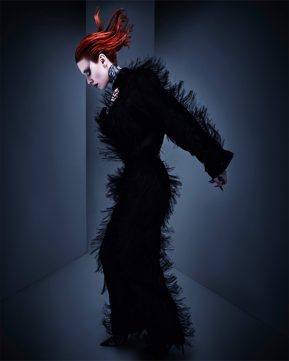 Casey Coleman - BHA Wales and South West Hairdresser of the Year 2025 - Stylised, Spiky Vibrant Red-orange Updo 