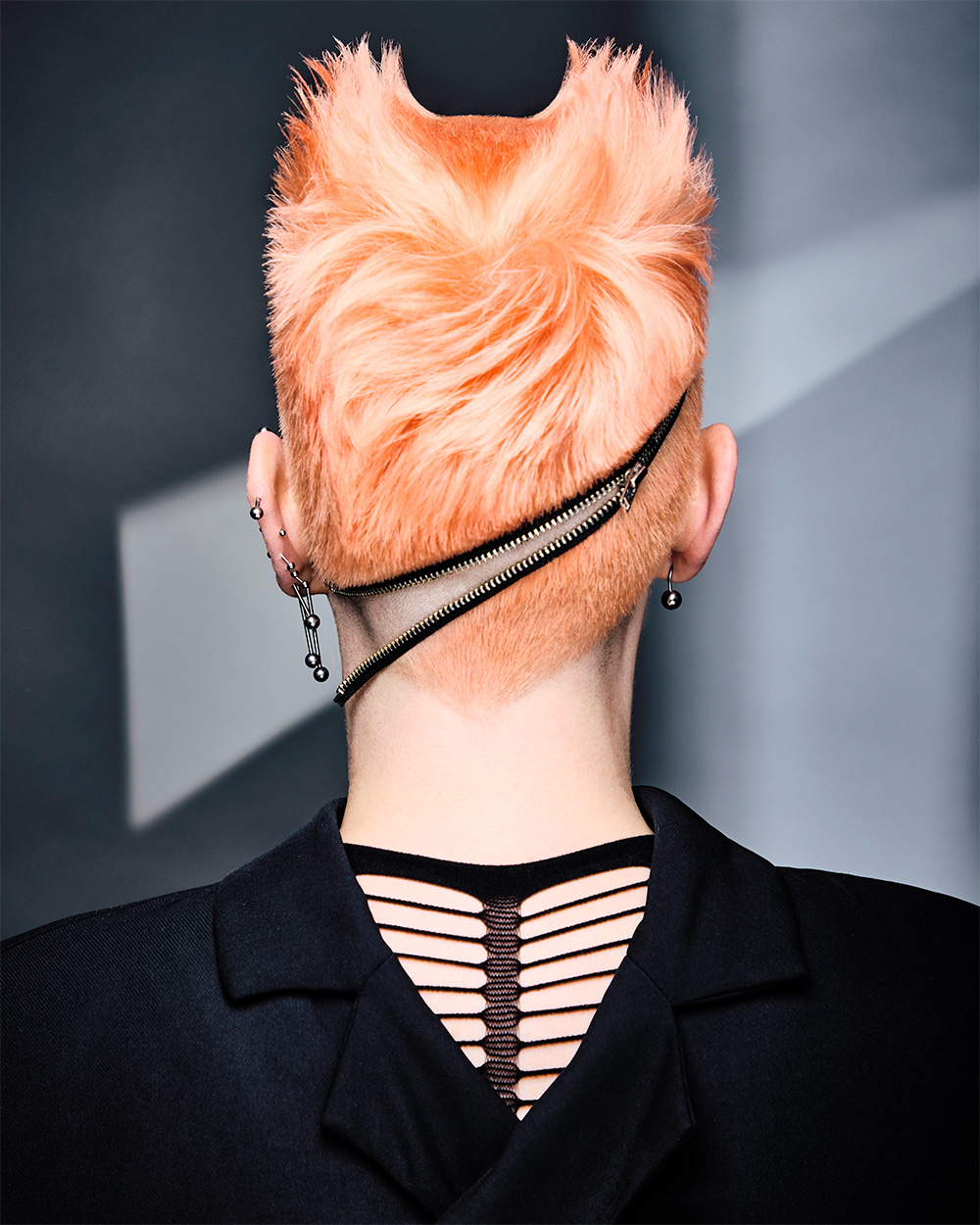 Fergal Doyle and Brandon Messinger - BHA Wales and South West Hairdresser of the Year 2025 - Light Orange Shaved Cut with Black Zipper