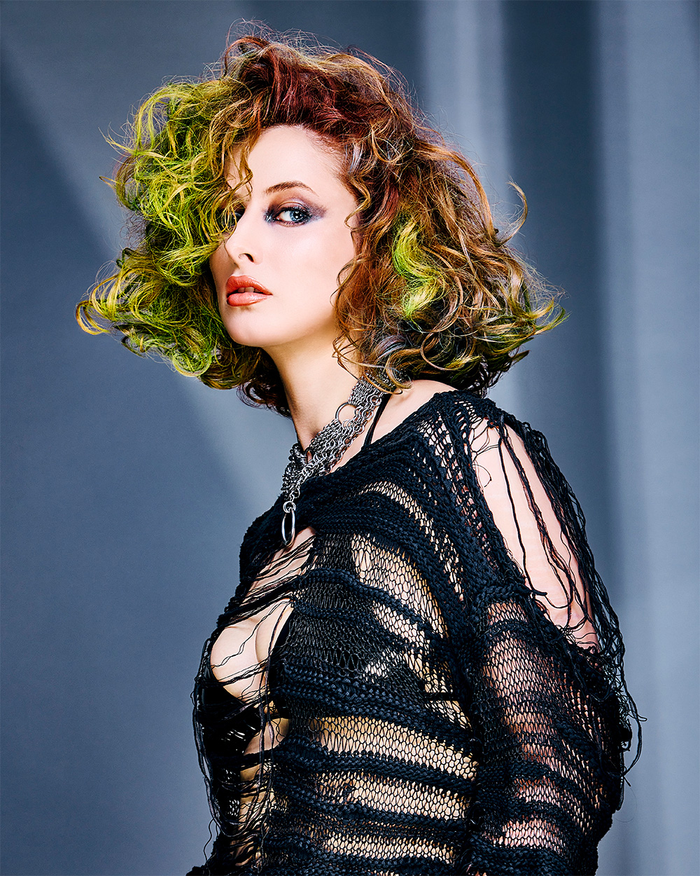 Fergal Doyle and Brandon Messinger - BHA Wales and South West Hairdresser of the Year 2025 - Curly bob with reddish-brown and bright yellow-green colors