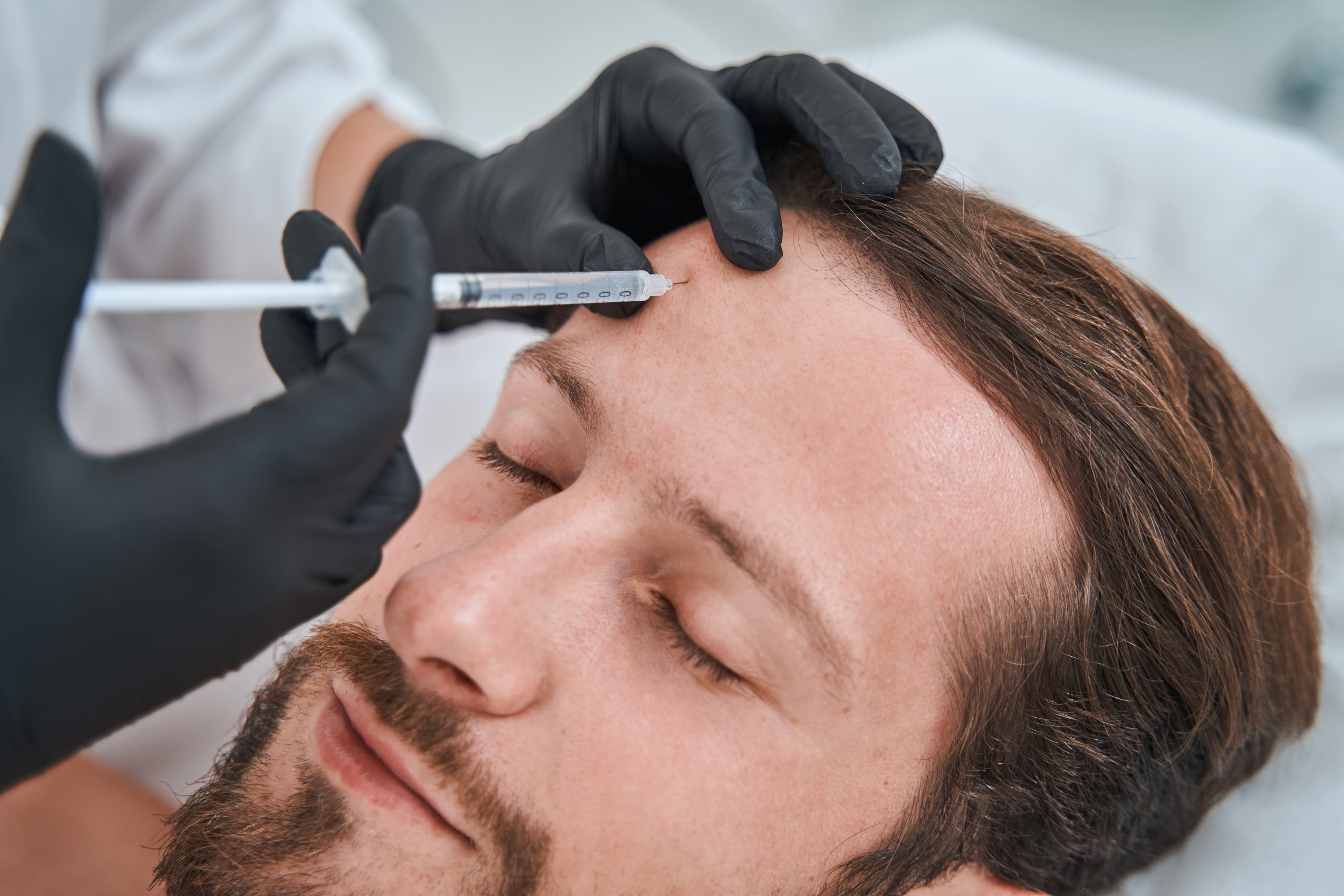 How can aesthetic clinics attract more male patients?