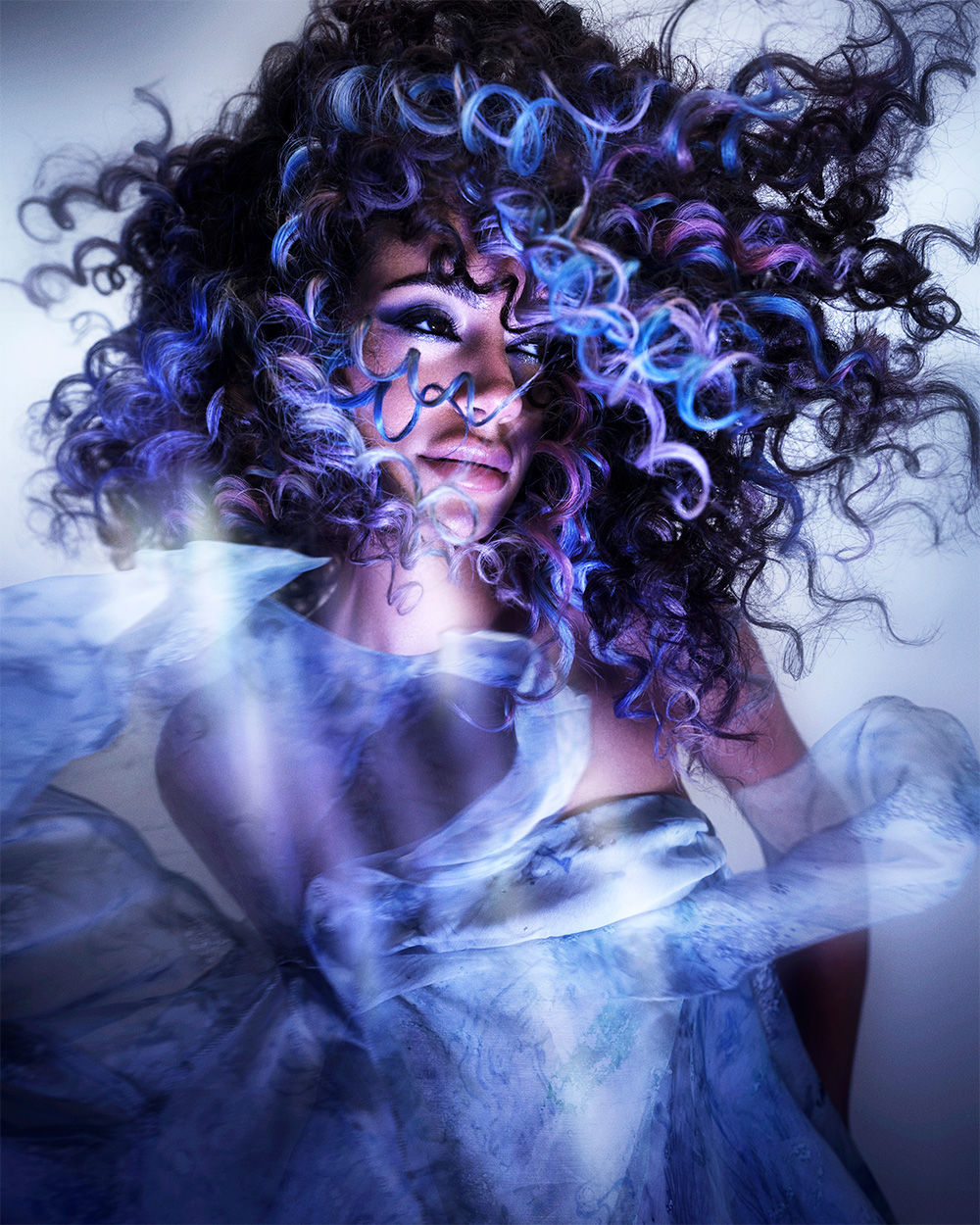 Voluminous Dark Curly Hair with Blue and Purple Highlights – Nikki Clifford – BHA Midlands Hairdresser of the Year 2026 Finalist Collection