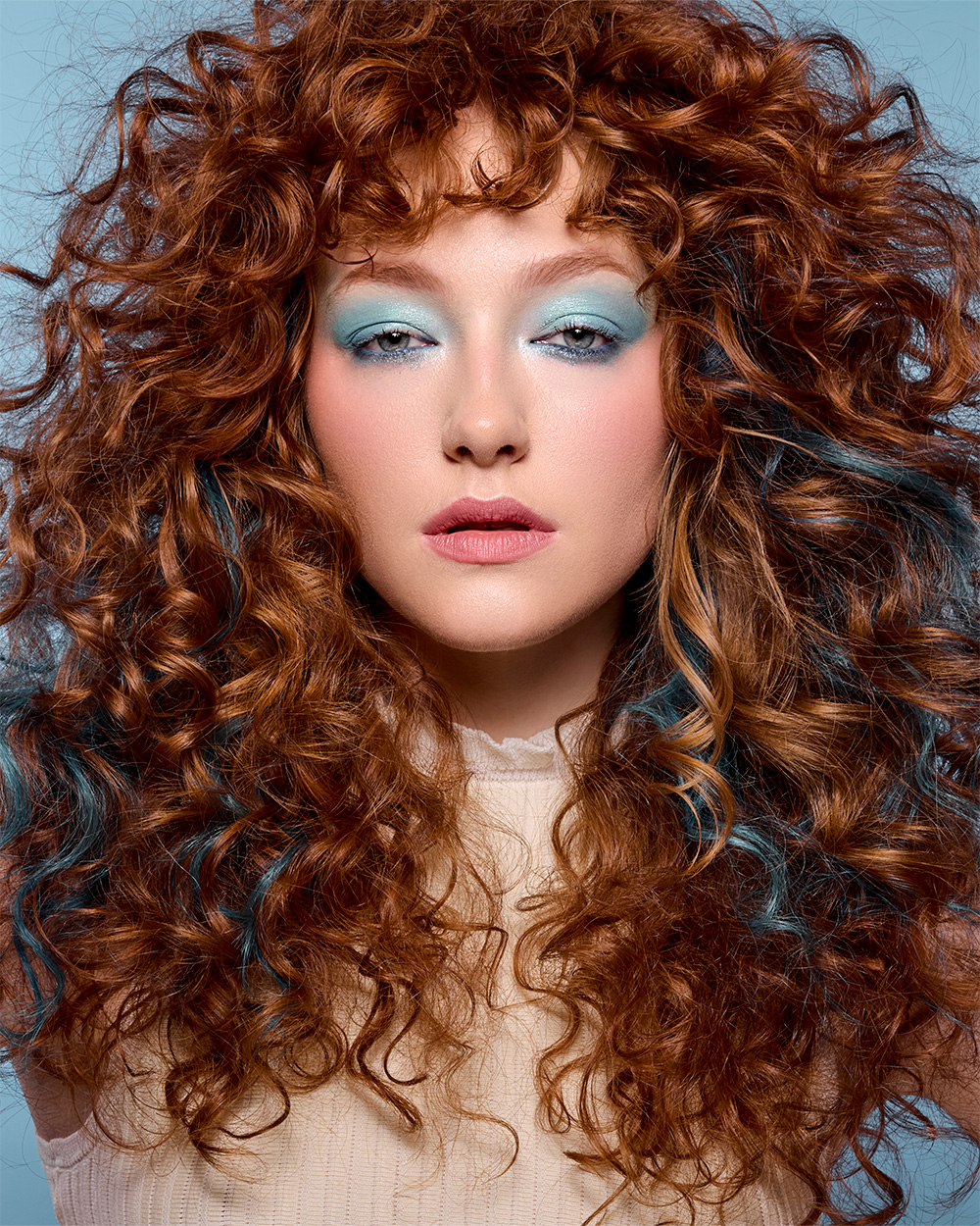 Copper Curly Hair with Blue Peekaboo Panels – Heather Shaw & Paul Corbett – BHA Midlands Hairdresser of the Year 2026 Finalist Collection